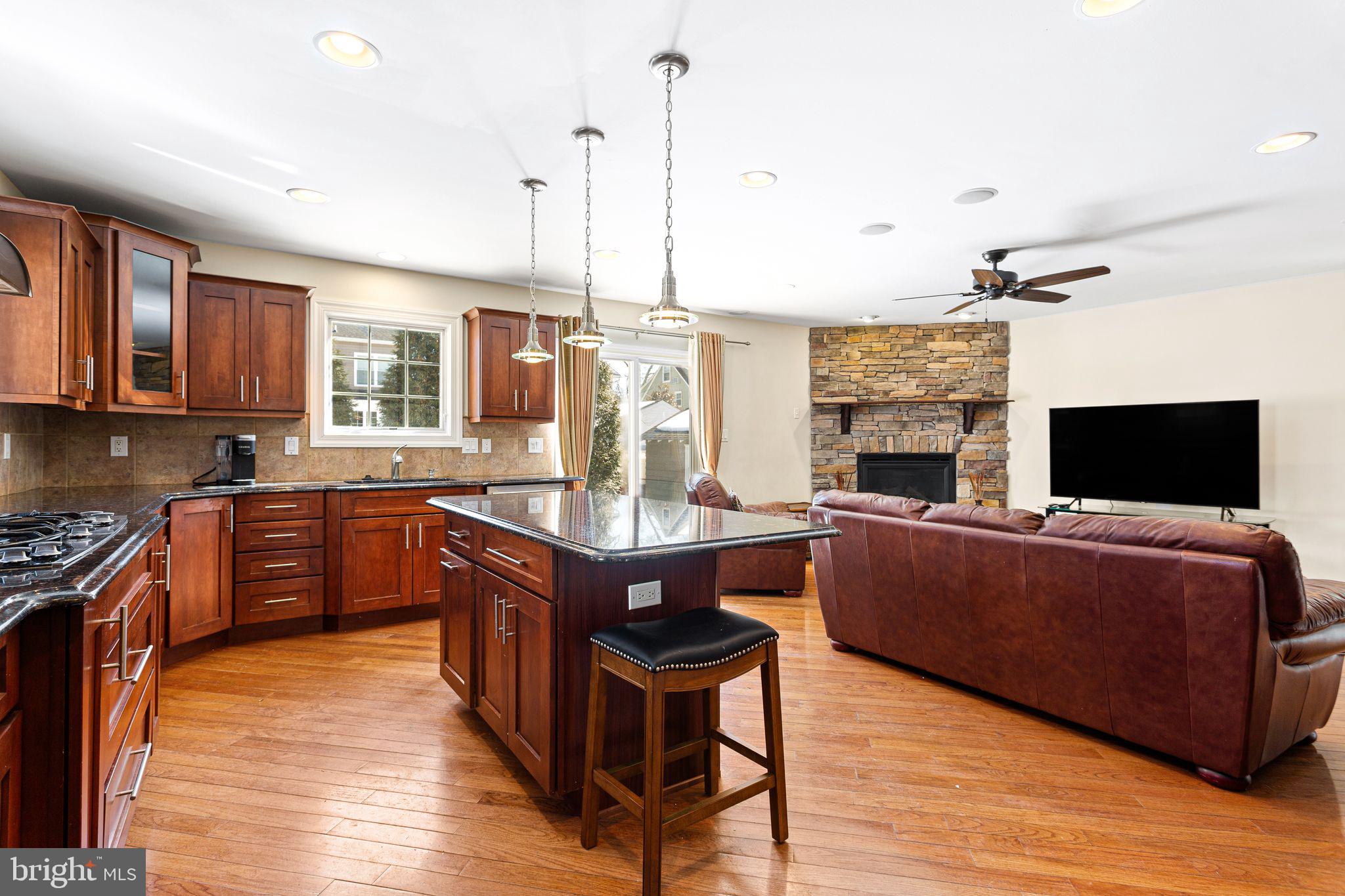 156 Ardmore Avenue Haddonfield, NJ 08033 - Photo 8 of 36 a large kitchen with stainless steel appliances granite countertop a stove a sink dishwasher and a flat screen tv