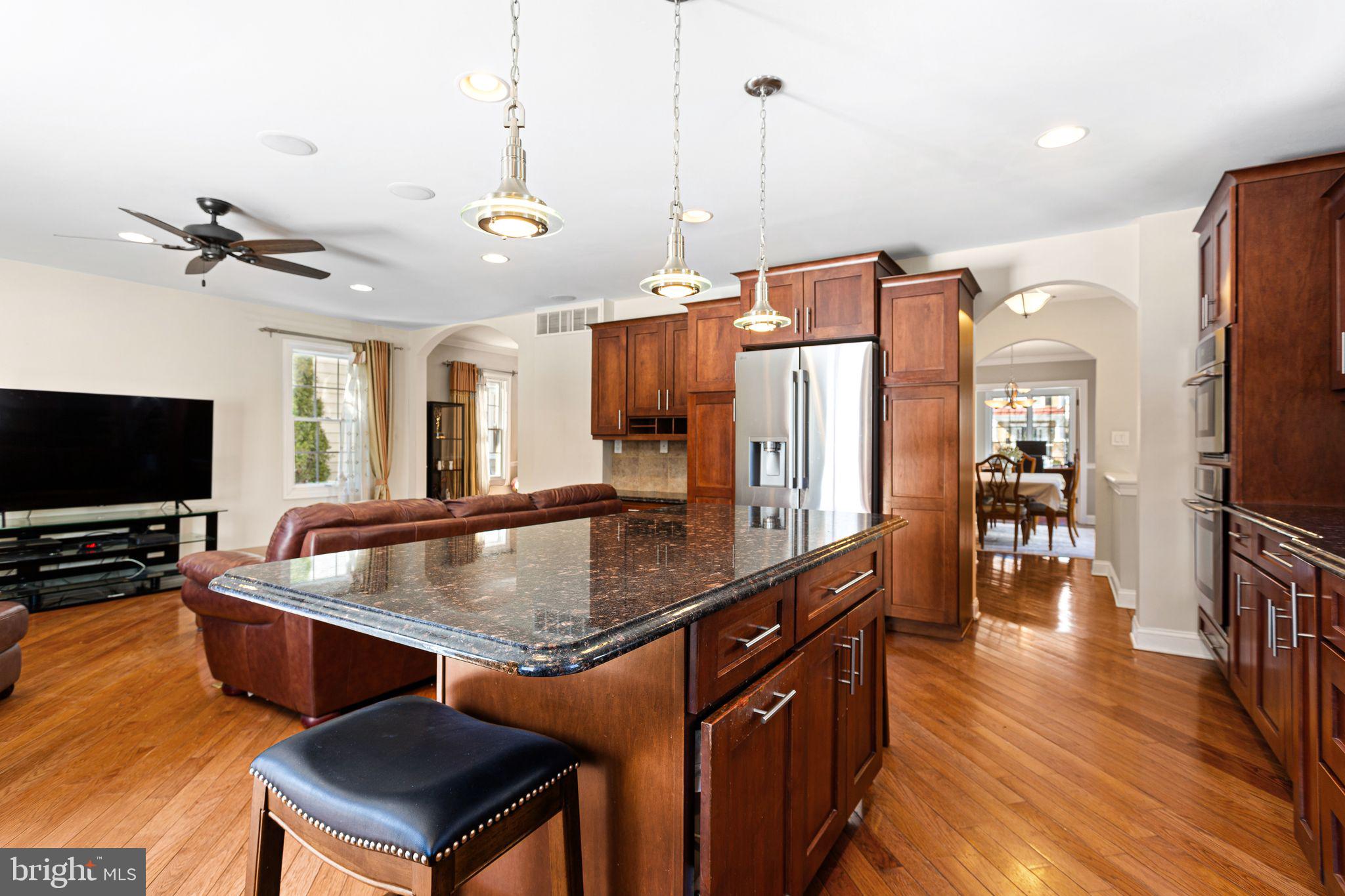 156 Ardmore Avenue Haddonfield, NJ 08033 - Photo 10 of 36 a kitchen with stainless steel appliances granite countertop a sink a stove and a refrigerator
