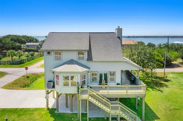 a aerial view of a house with a yard