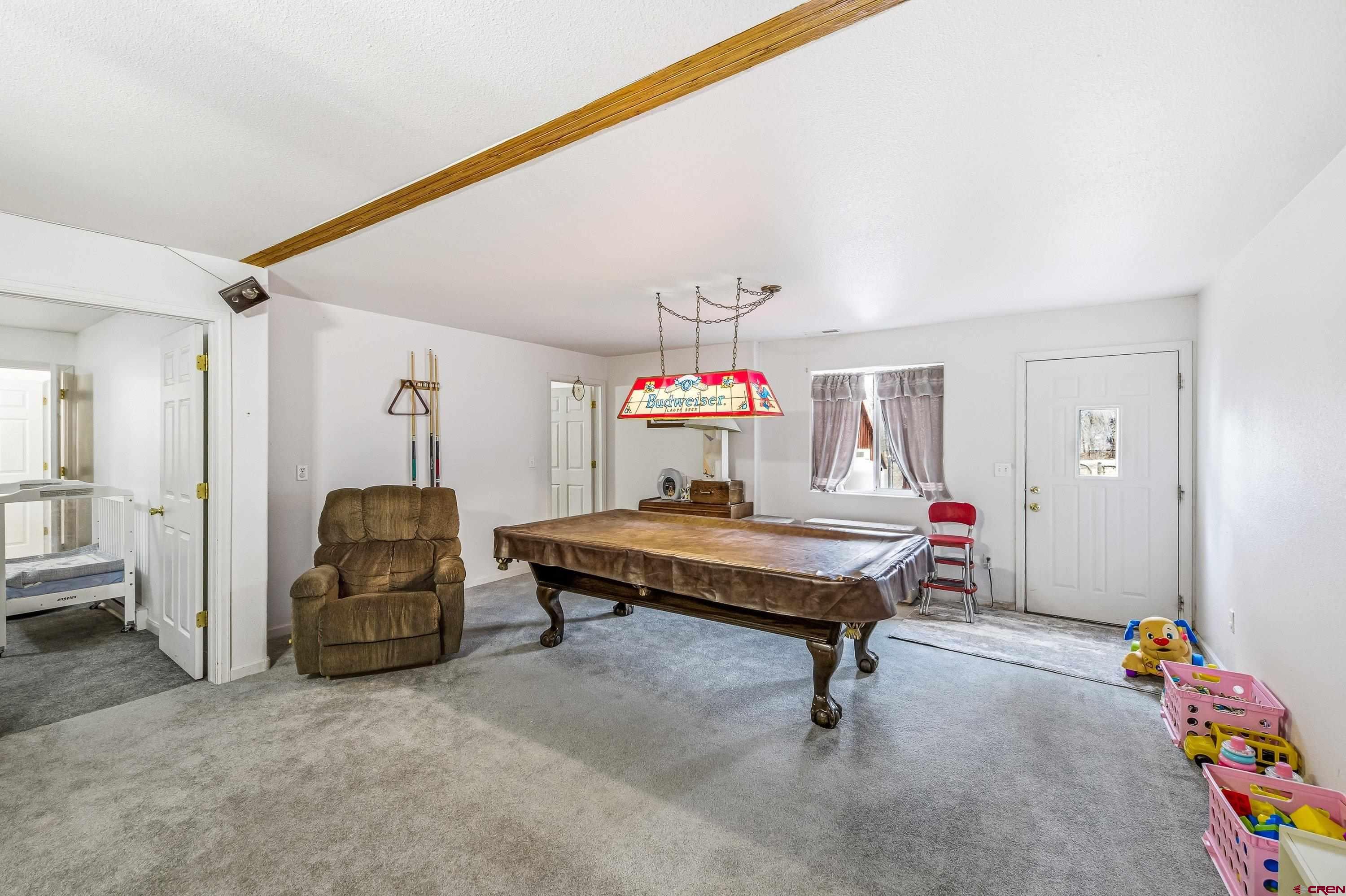 14414 G Road Delta, CO 81416 - Photo 16 of 39 a bedroom with furniture and a ceiling fan