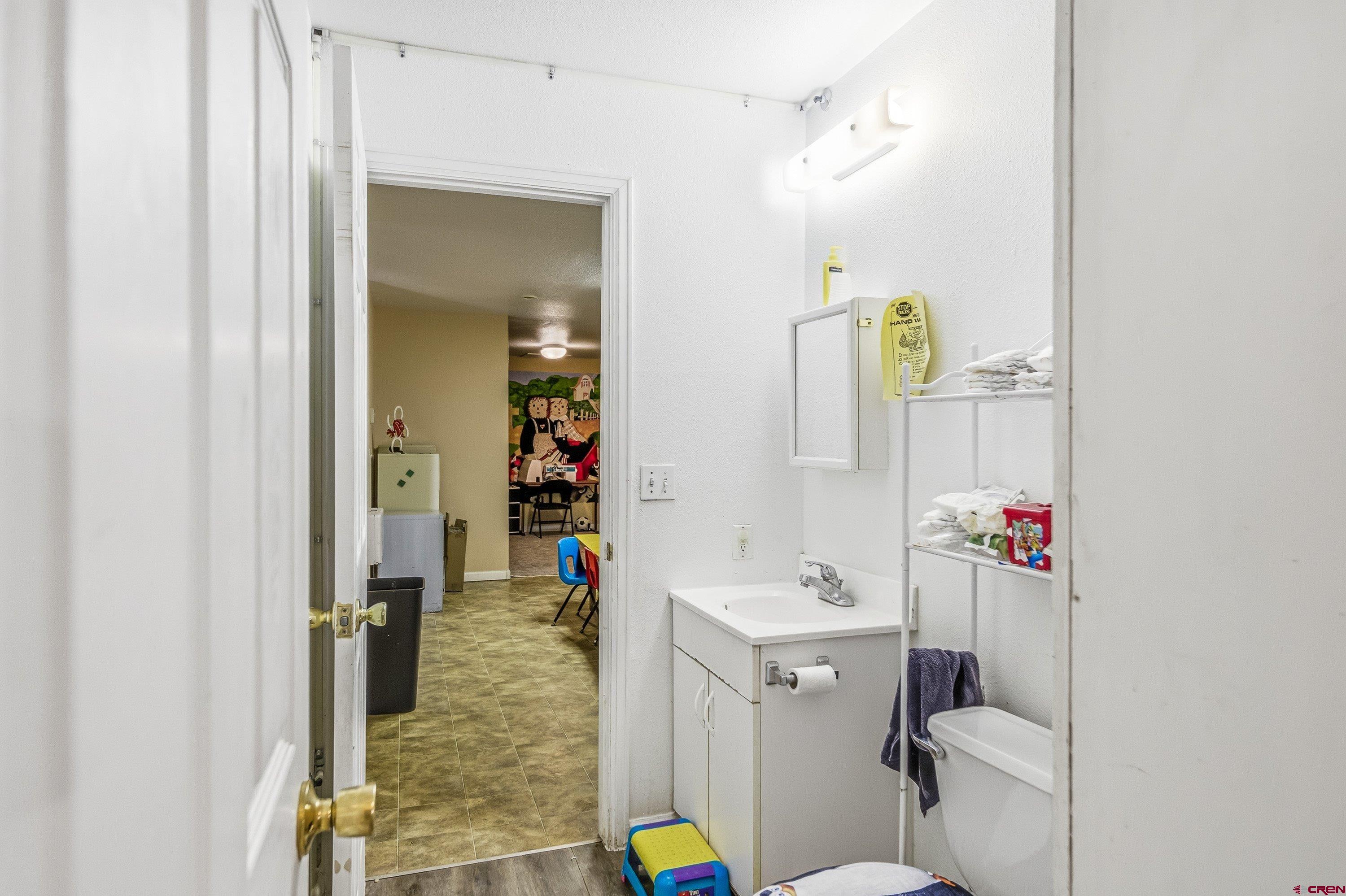14414 G Road Delta, CO 81416 - Photo 26 of 39 a bathroom with a sink vanity mirror and toilet