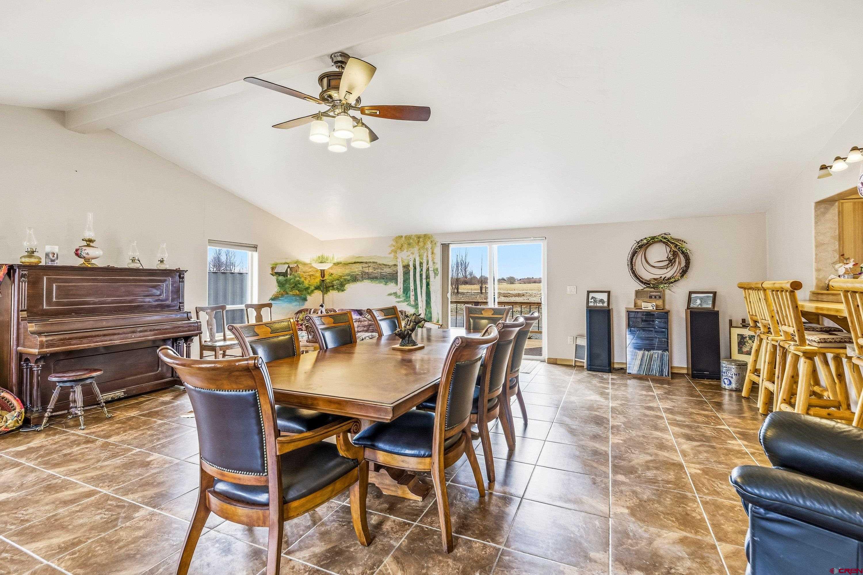 14414 G Road Delta, CO 81416 - Photo 37 of 39 a dining room with furniture window and wooden floor