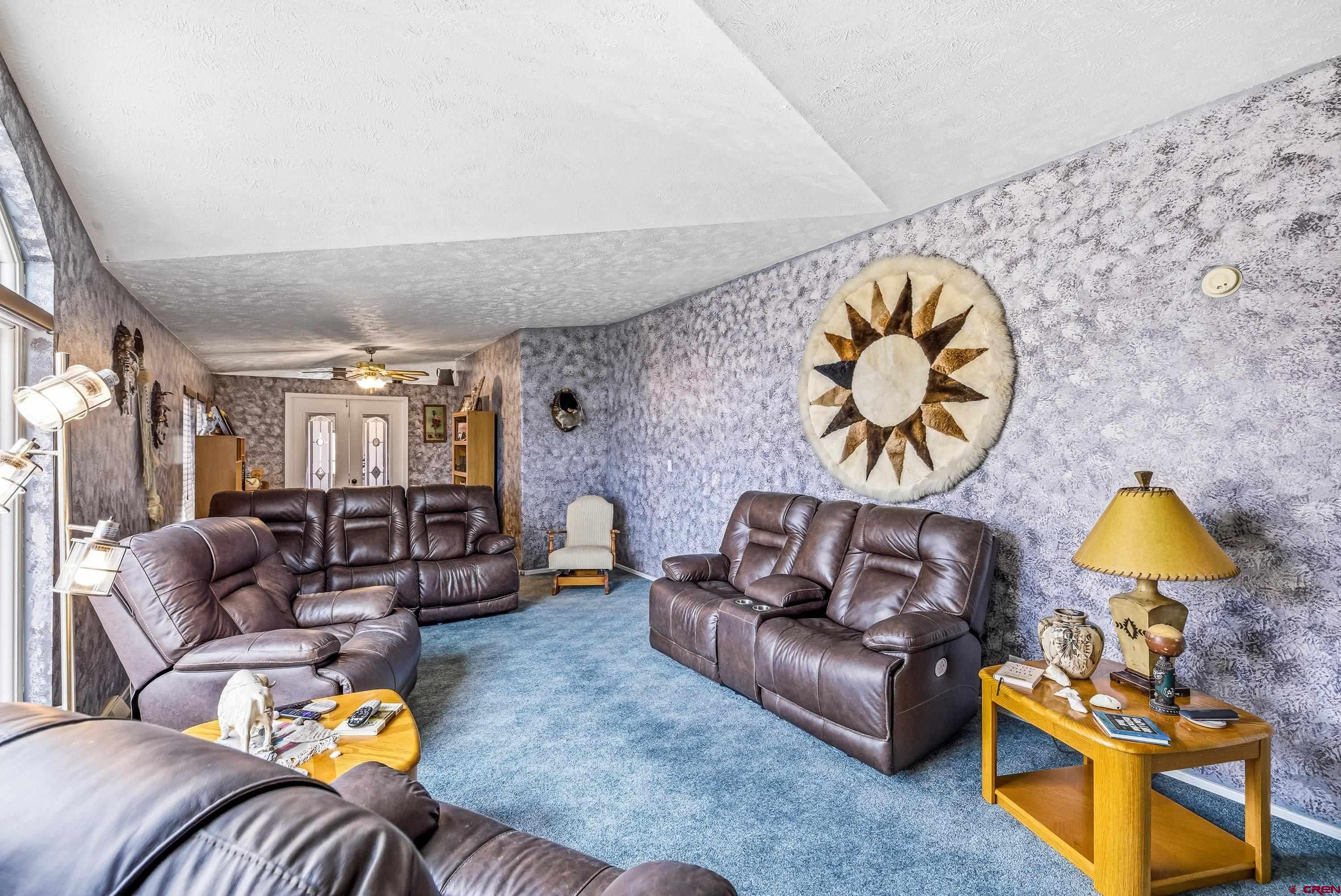 14414 G Road Delta, CO 81416 - Photo 38 of 39 a living room with furniture and wooden floor