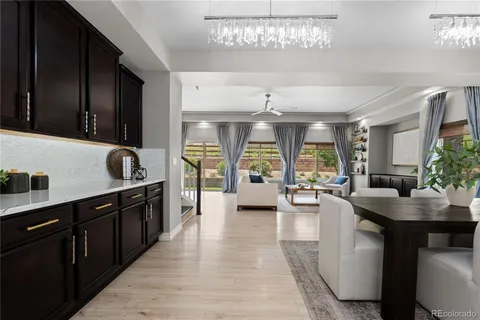 a kitchen with sink cabinets and living room view