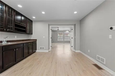 a kitchen with stainless steel appliances granite countertop a stove and cabinets