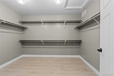 a view of a room with racks on the wall