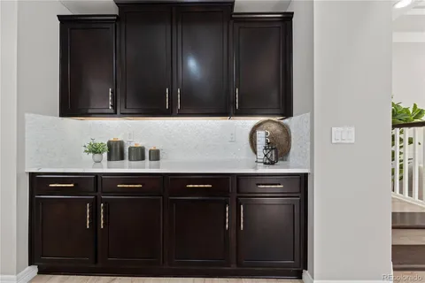 a sink sitting inside of a kitchen