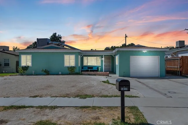 a front view of a house with yard