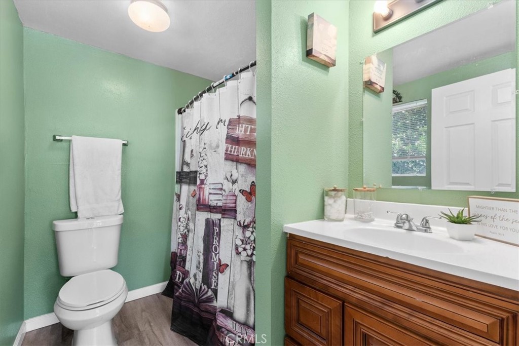 1417 West Marshall Boulevard San Bernardino, CA 92405 - Photo 20 of 39 a bathroom with a sink toilet and shower