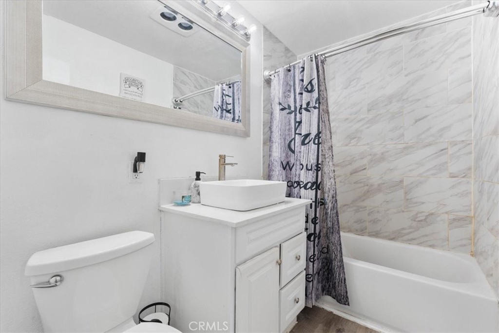 1417 West Marshall Boulevard San Bernardino, CA 92405 - Photo 23 of 39 a bathroom with a sink a toilet and shower