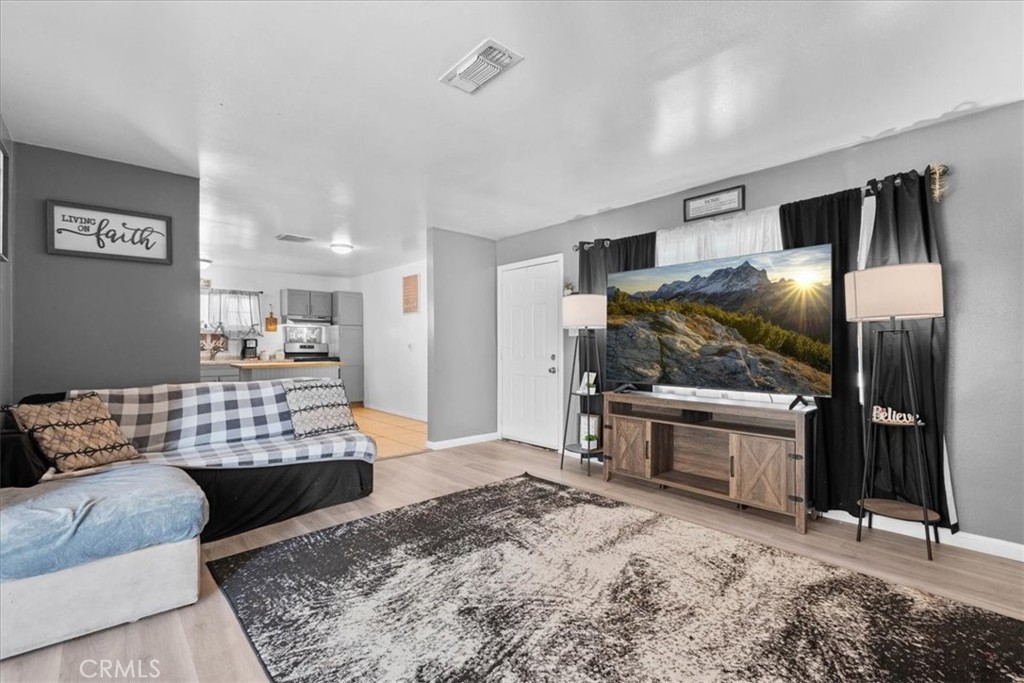 1417 West Marshall Boulevard San Bernardino, CA 92405 - Photo 8 of 39 a bedroom with furniture and window