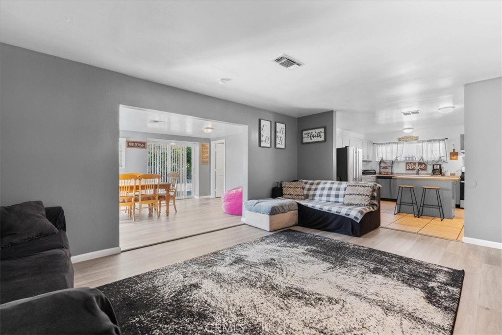 1417 West Marshall Boulevard San Bernardino, CA 92405 - Photo 9 of 39 a living room with furniture and a table