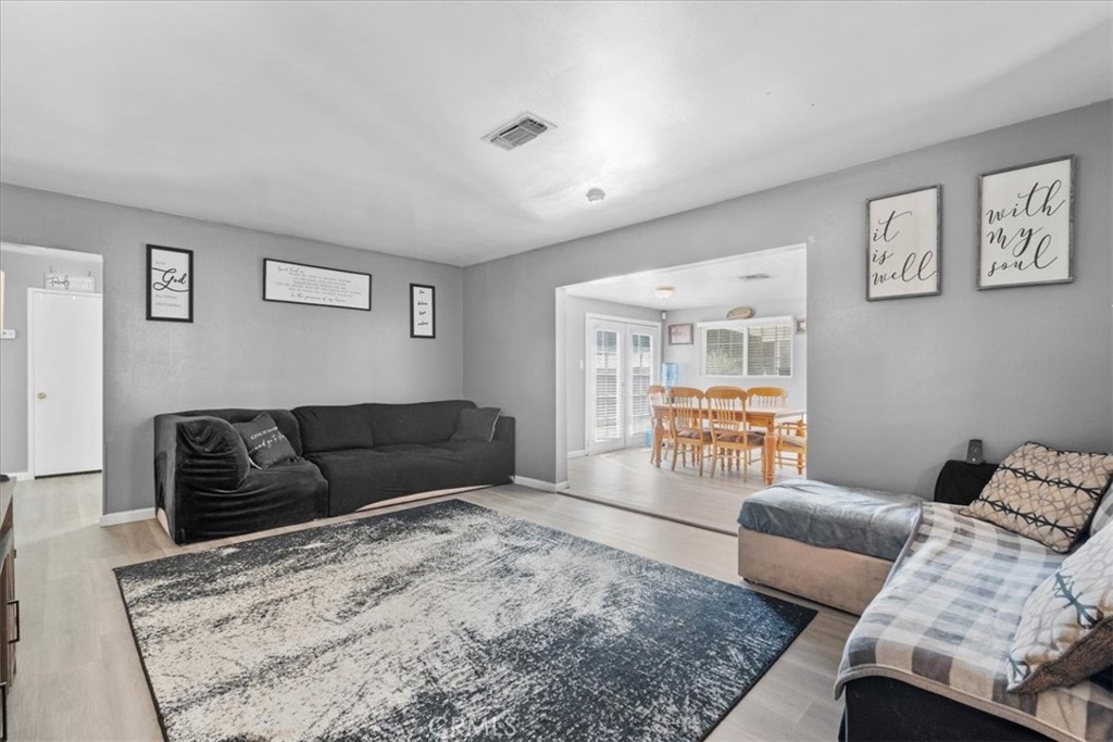 1417 West Marshall Boulevard San Bernardino, CA 92405 - Photo 10 of 39 a living room with furniture and a large window