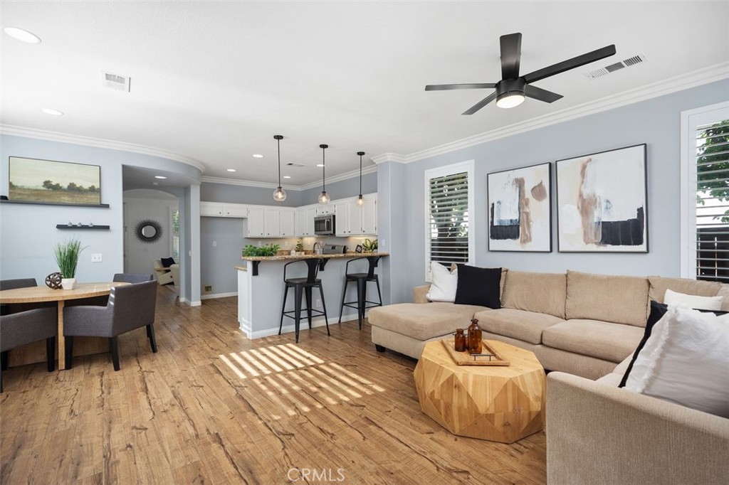 8 Tradition Lane Rancho Santa Margarita, CA 92688 - Photo 11 of 43 a living room with furniture and a wooden floor