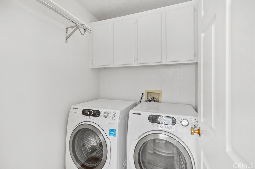 8 Tradition Lane Rancho Santa Margarita, CA 92688 - Photo 17 of 43 a utility room with dryer and washer