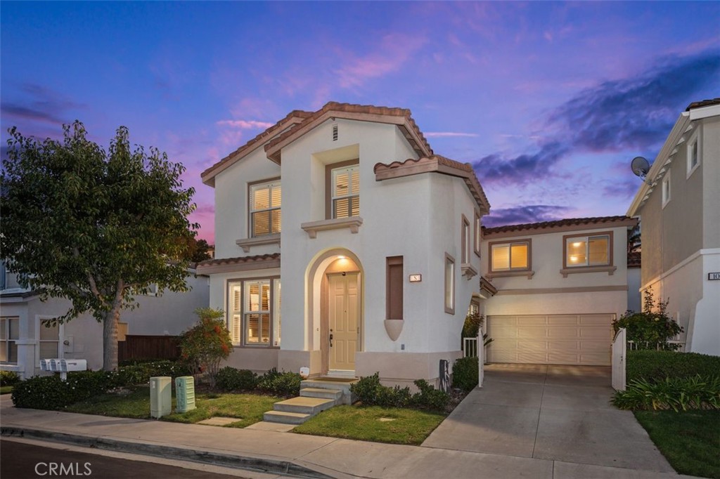 8 Tradition Lane Rancho Santa Margarita, CA 92688 - Photo 2 of 43 a front view of a house with a yard