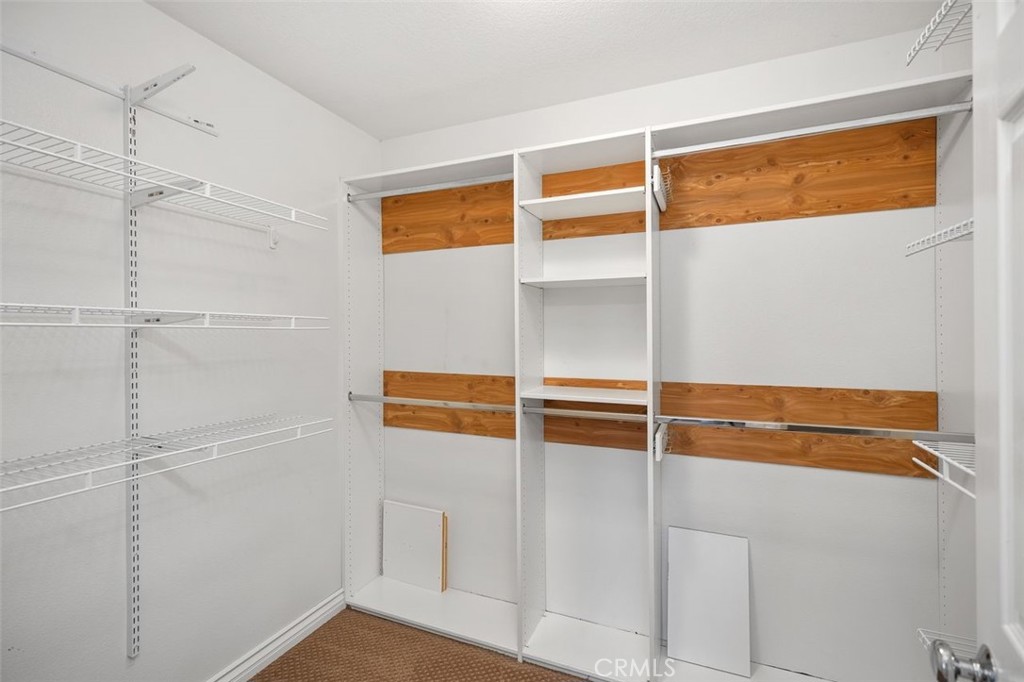 8 Tradition Lane Rancho Santa Margarita, CA 92688 - Photo 22 of 43 a view of a room with shelves