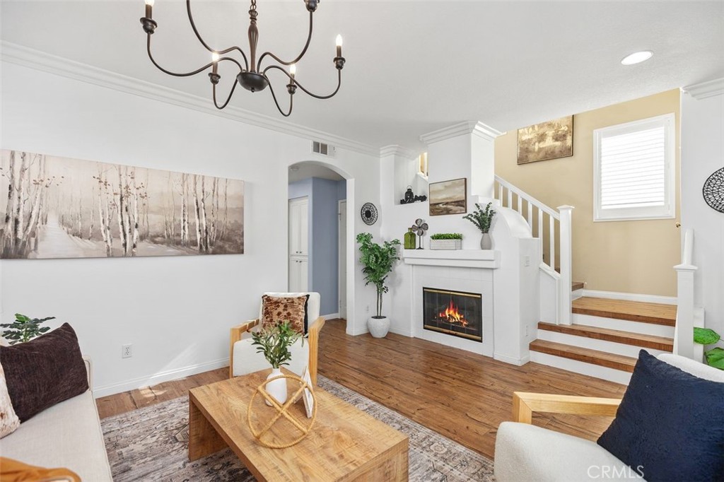 8 Tradition Lane Rancho Santa Margarita, CA 92688 - Photo 4 of 43 a living room with furniture and a fireplace
