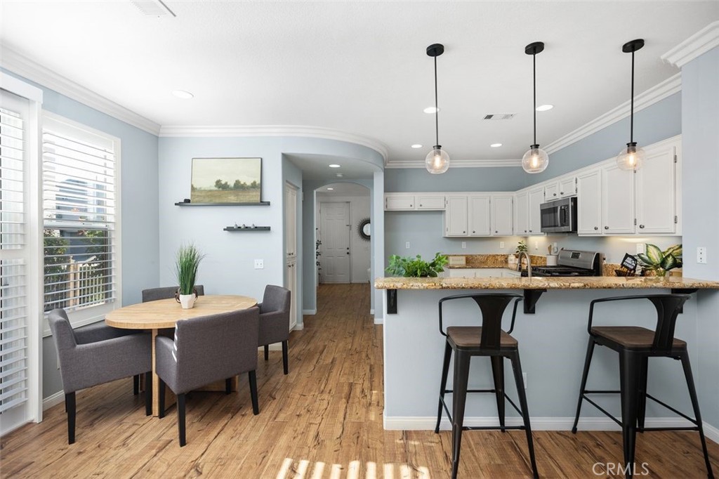 8 Tradition Lane Rancho Santa Margarita, CA 92688 - Photo 8 of 43 a large kitchen with a table and chairs