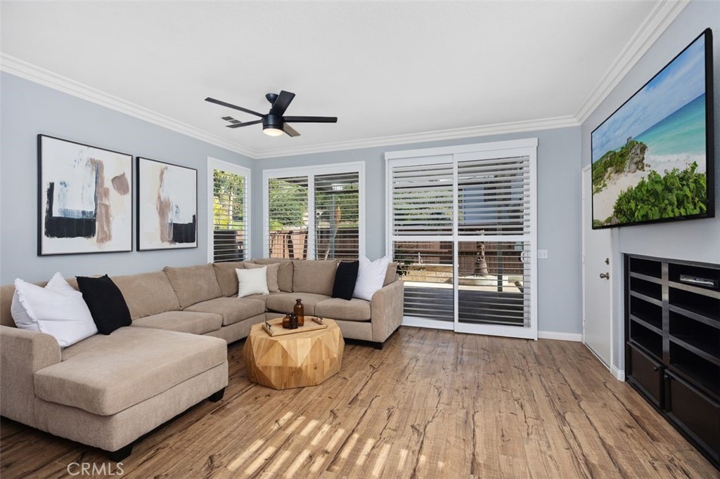 8 Tradition Lane Rancho Santa Margarita, CA 92688 - Photo 10 of 43 a living room with furniture and a flat screen tv