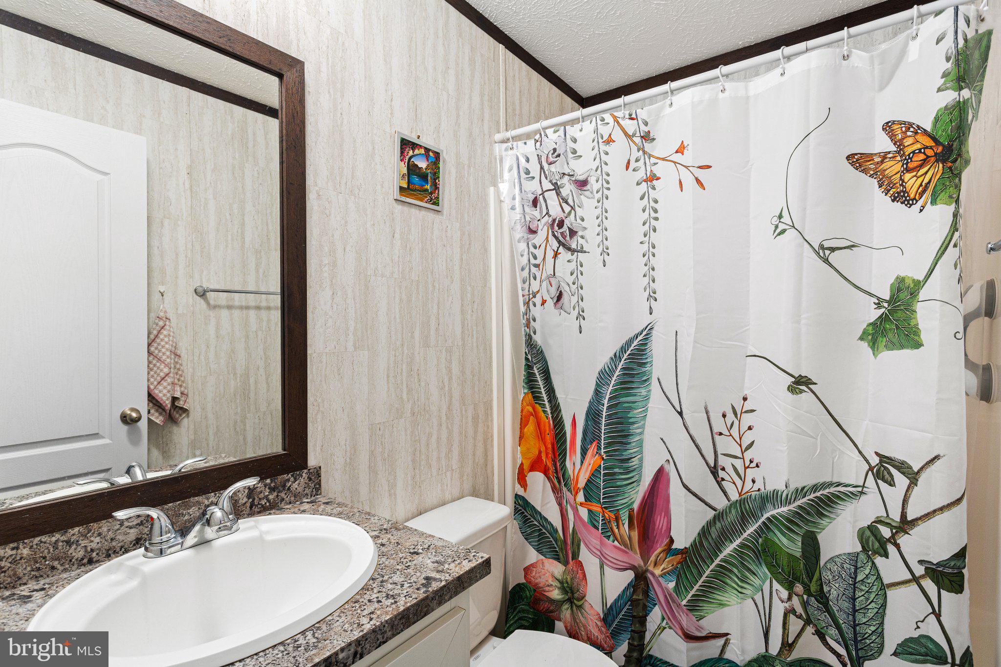 234 Iris Road Mullica Hill, NJ 08062 - Photo 10 of 15 Vibrant floral oasis in a bathroom.