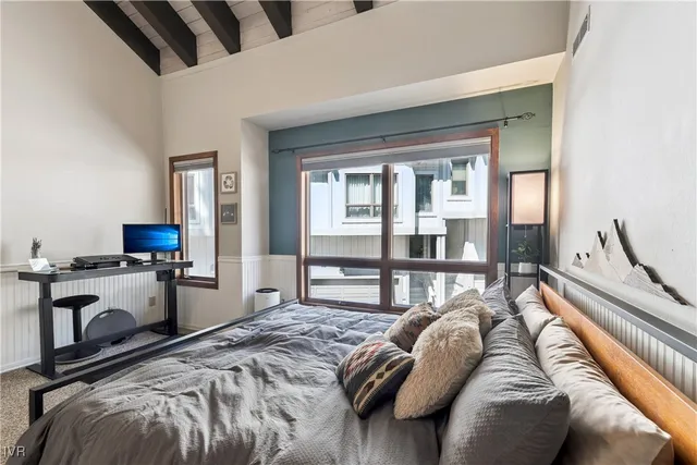 a spacious bathroom with a double vanity sink and a mirror