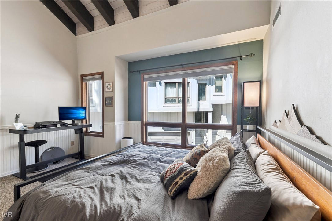 908 Harold Drive, Unit 23 Incline Village, NV 89451 - Photo 11 of 36 a bedroom with a bed and a flat tv screen on dresser