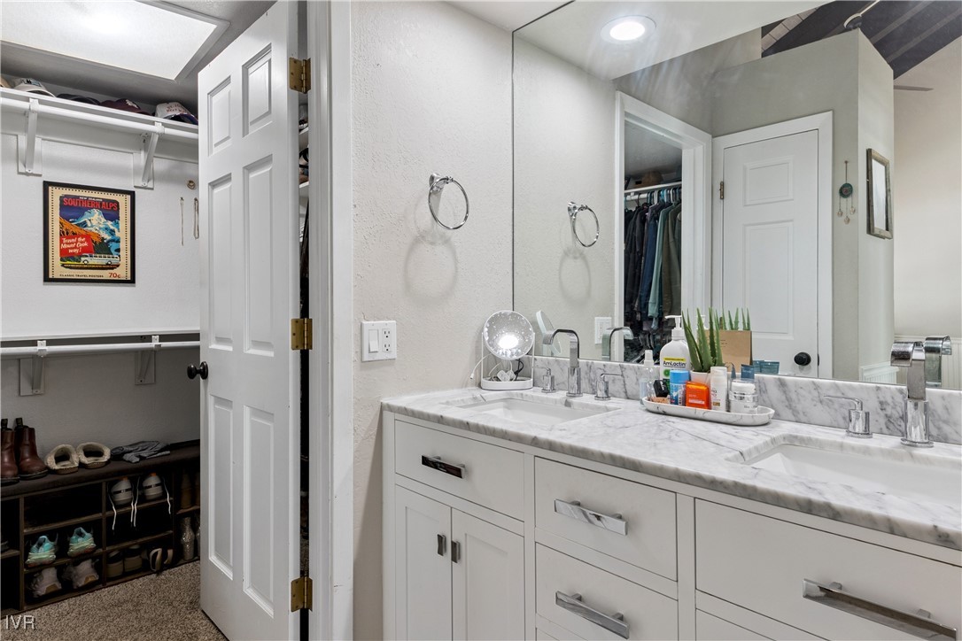 908 Harold Drive, Unit 23 Incline Village, NV 89451 - Photo 12 of 36 a bathroom with double vanity sinks a vanity and a shower