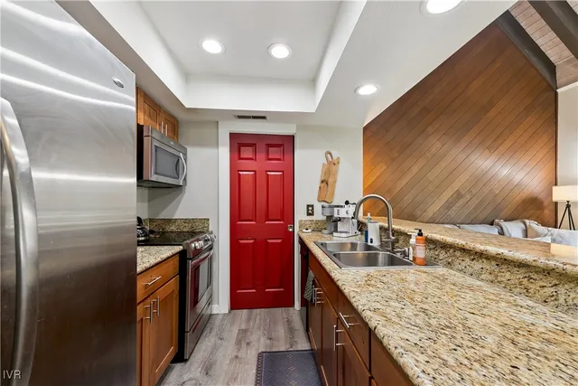 a bathroom with a sink a mirror and a toilet