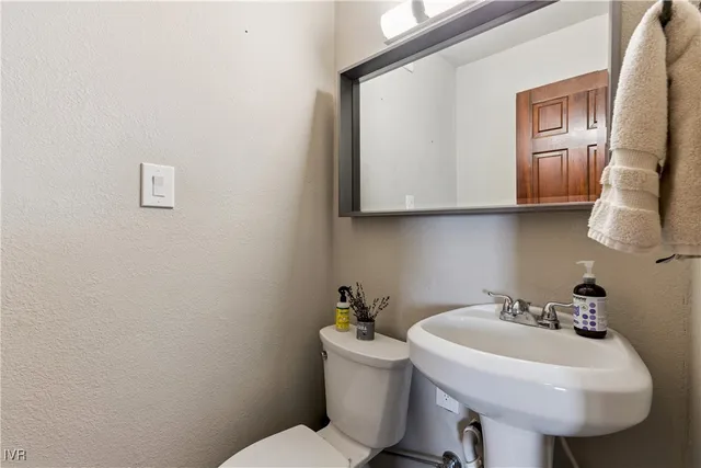 a bathroom with double vanity sinks a vanity and a shower