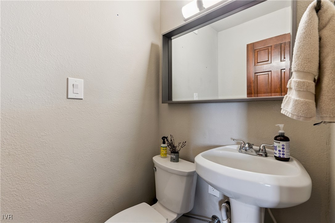908 Harold Drive, Unit 23 Incline Village, NV 89451 - Photo 9 of 36 a bathroom with a sink a mirror and a toilet