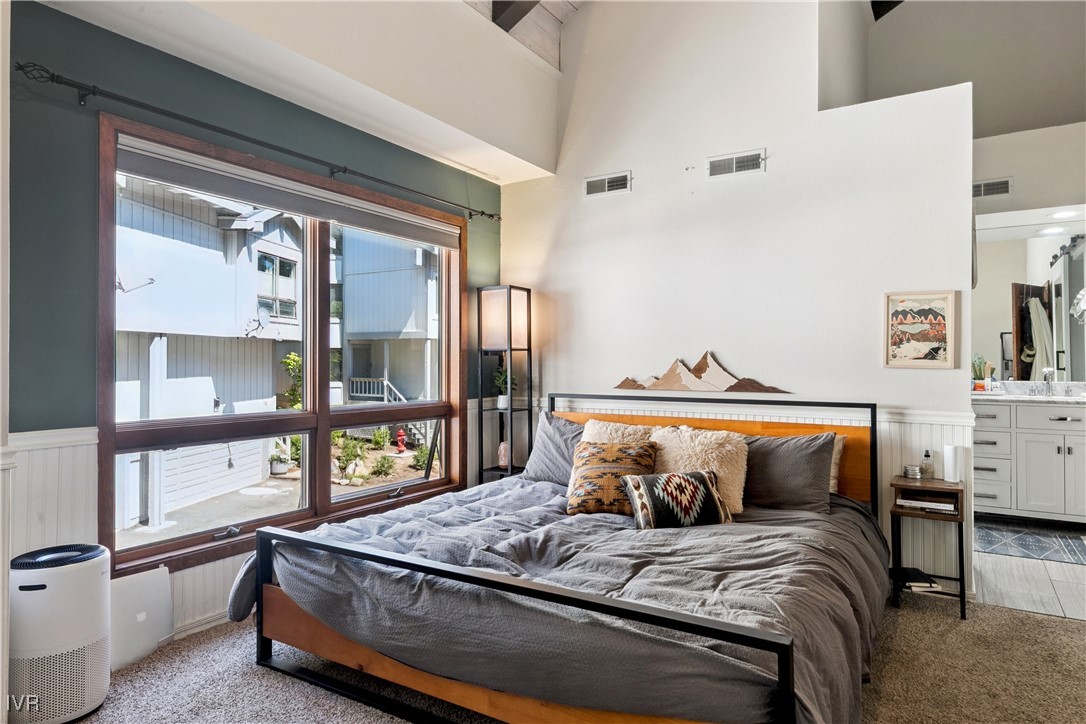 908 Harold Drive, Unit 23 Incline Village, NV 89451 - Photo 10 of 36 a bed sitting in a bedroom next to a window