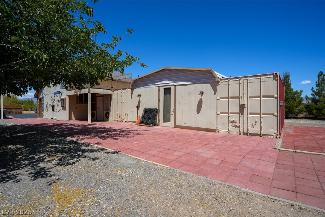 1831 West Horn Road Pahrump, NV 89048 - Photo 45 of 59 A versatile exterior space featuring both paved and gravel areas, perfect for various outdoor activities.