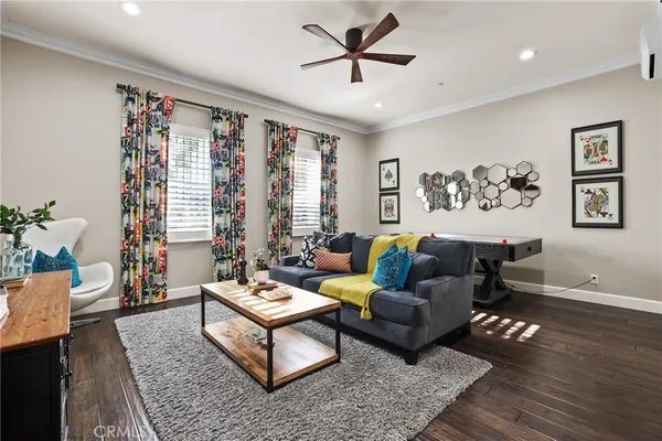 a room with furniture and paintings on the wall