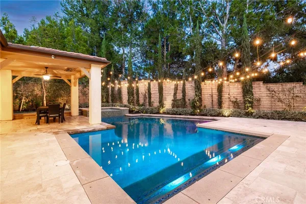 an aerial view of residential house with outdoor space and swimming pool