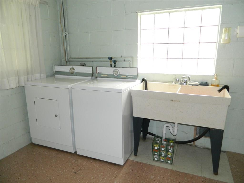 82 Elm Road Hickory, PA 15340 - Photo 22 of 25 The lower level has a large laundry room. Washer and dryer are included.