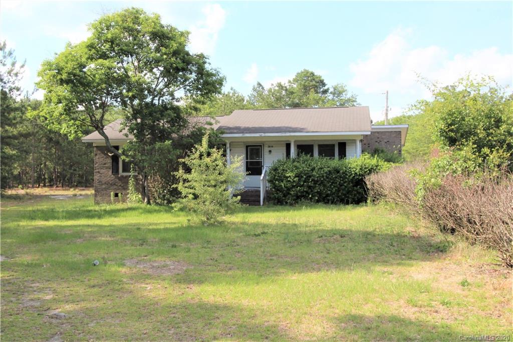 308 Sandy Ridge Church Road Morven, NC 28119 - Photo 1 of 10 a house view with swimming pool