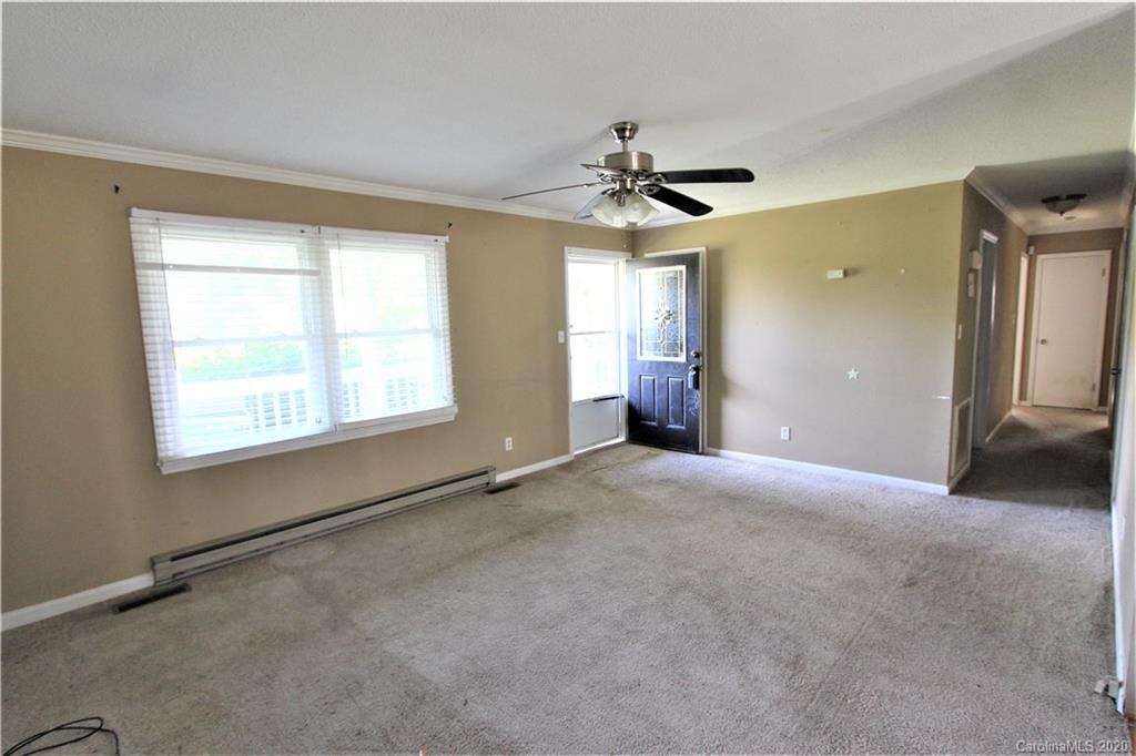 308 Sandy Ridge Church Road Morven, NC 28119 - Photo 3 of 10 a view of a livingroom with a ceiling fan and window