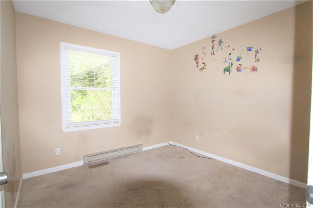 308 Sandy Ridge Church Road Morven, NC 28119 - Photo 8 of 10 an empty room with a window