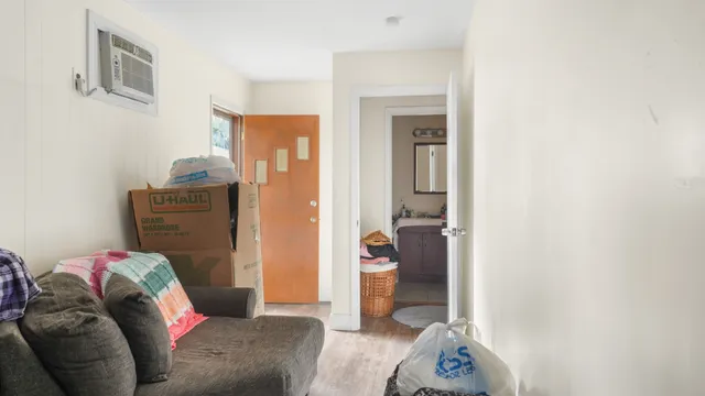 a living room with furniture and a gate