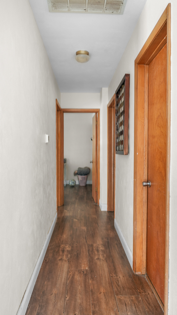 504 East Florida Avenue Urbana, IL 61801 - Photo 13 of 19 a view of a room with wooden floor