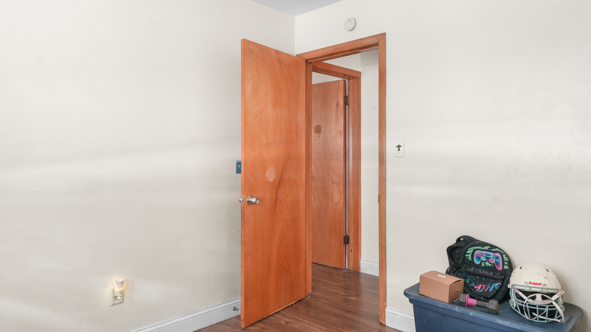504 East Florida Avenue Urbana, IL 61801 - Photo 16 of 19 a room with wooden floor and shoes