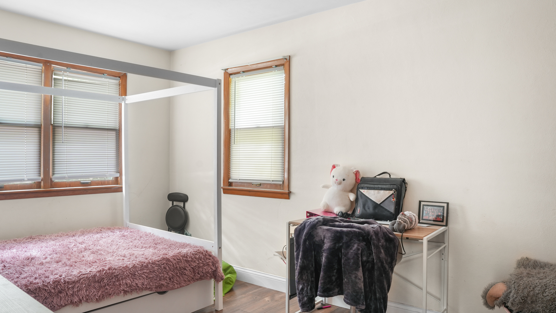 504 East Florida Avenue Urbana, IL 61801 - Photo 17 of 19 a bedroom with a bed and wooden floor