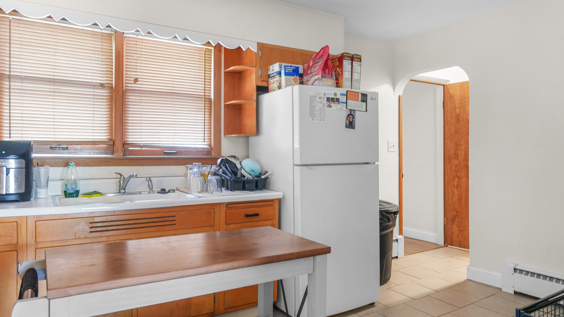 504 East Florida Avenue Urbana, IL 61801 - Photo 6 of 19 a kitchen with refrigerator and window