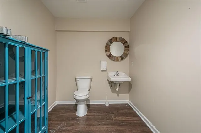 a bathroom with a toilet and a sink