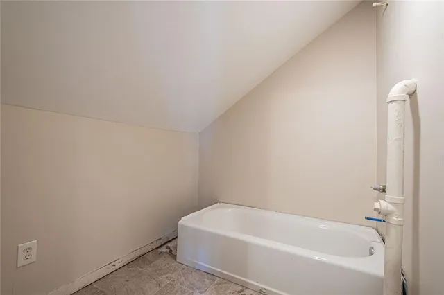a white bath tub sitting in a bathroom