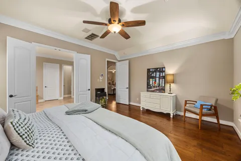 a bedroom with a bed and a desk