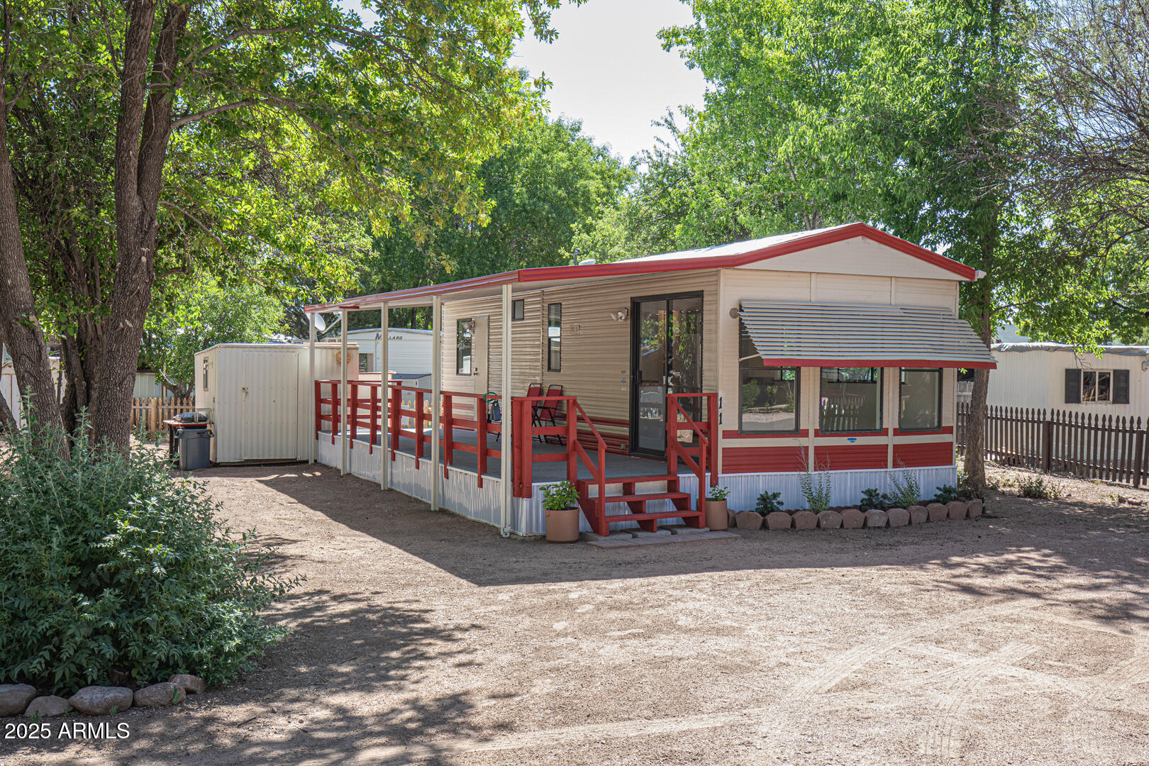 16 North Star Vale Road, Unit 11 Star Valley, AZ 85541 - Photo 1 of 24 a view of a house with wooden fence next to a road