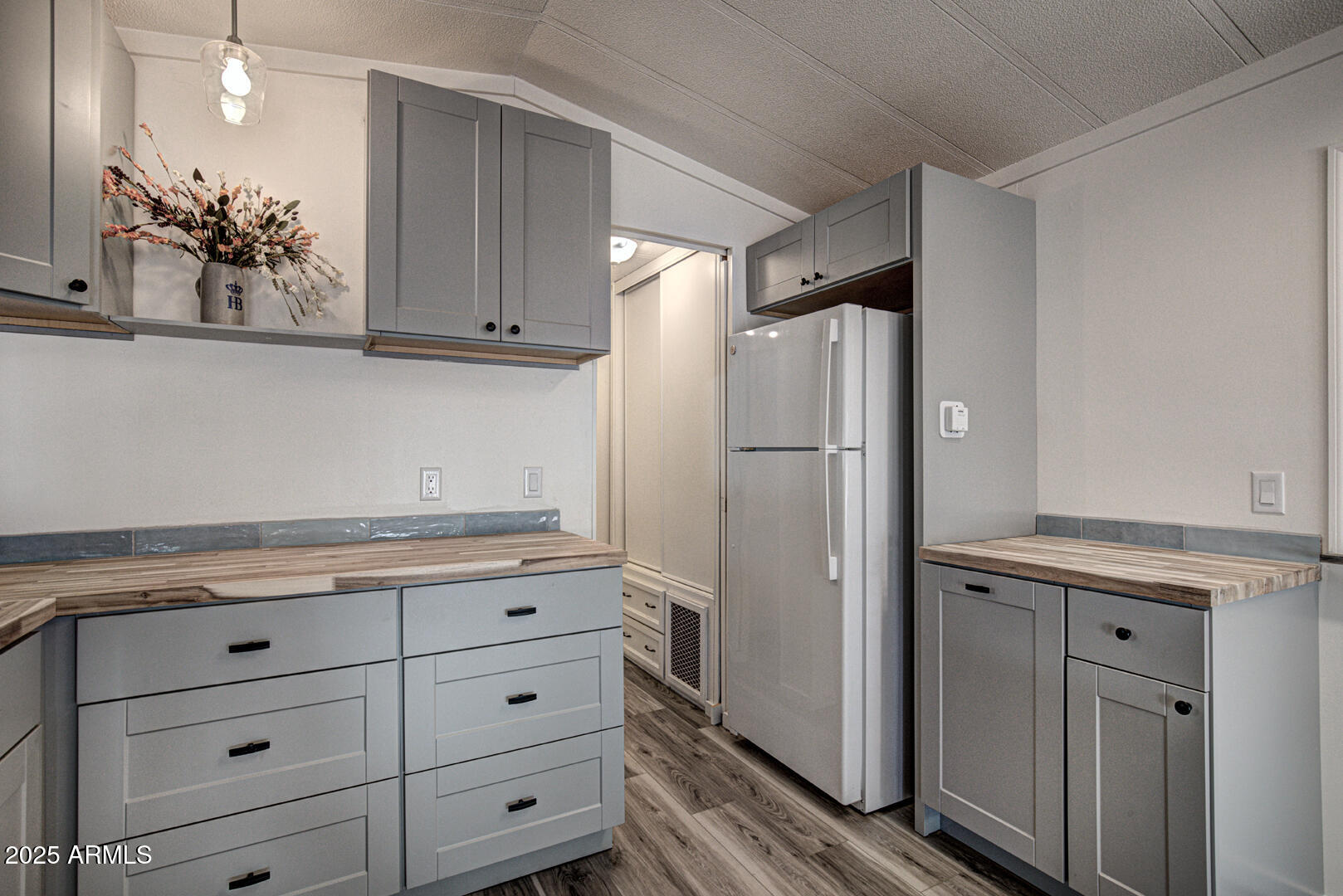 16 North Star Vale Road, Unit 11 Star Valley, AZ 85541 - Photo 12 of 24 a kitchen with a refrigerator and cabinets