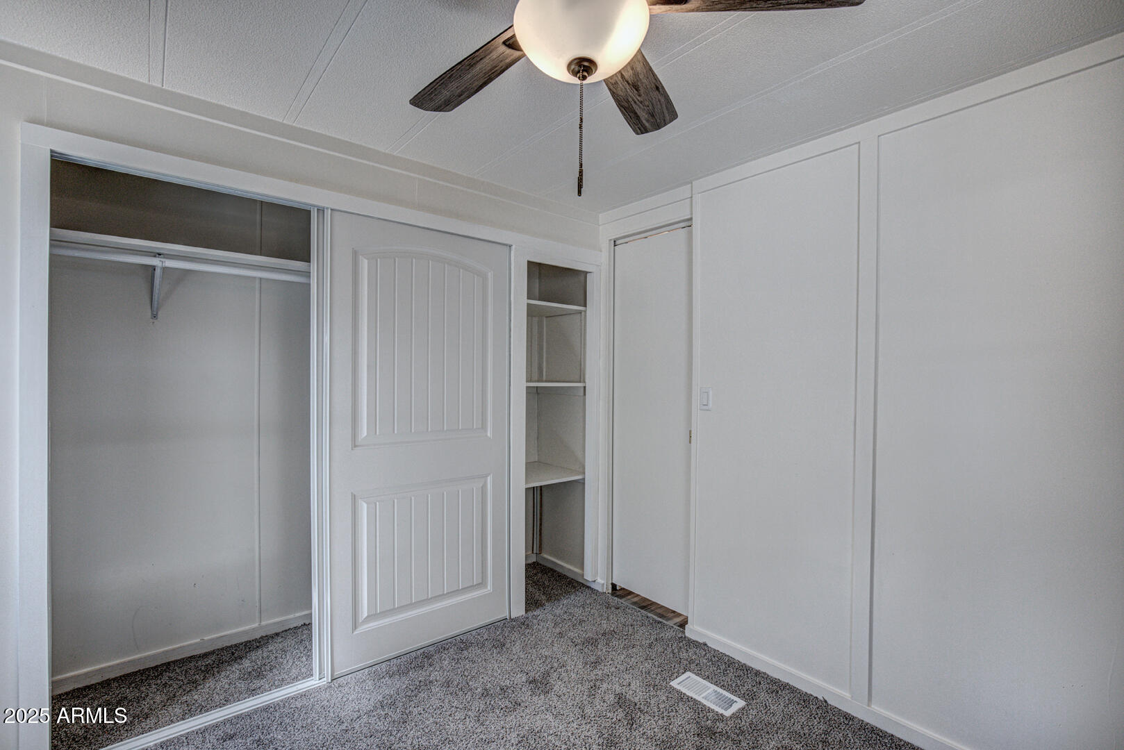 16 North Star Vale Road, Unit 11 Star Valley, AZ 85541 - Photo 20 of 24 a view of an empty room and chandelier fan